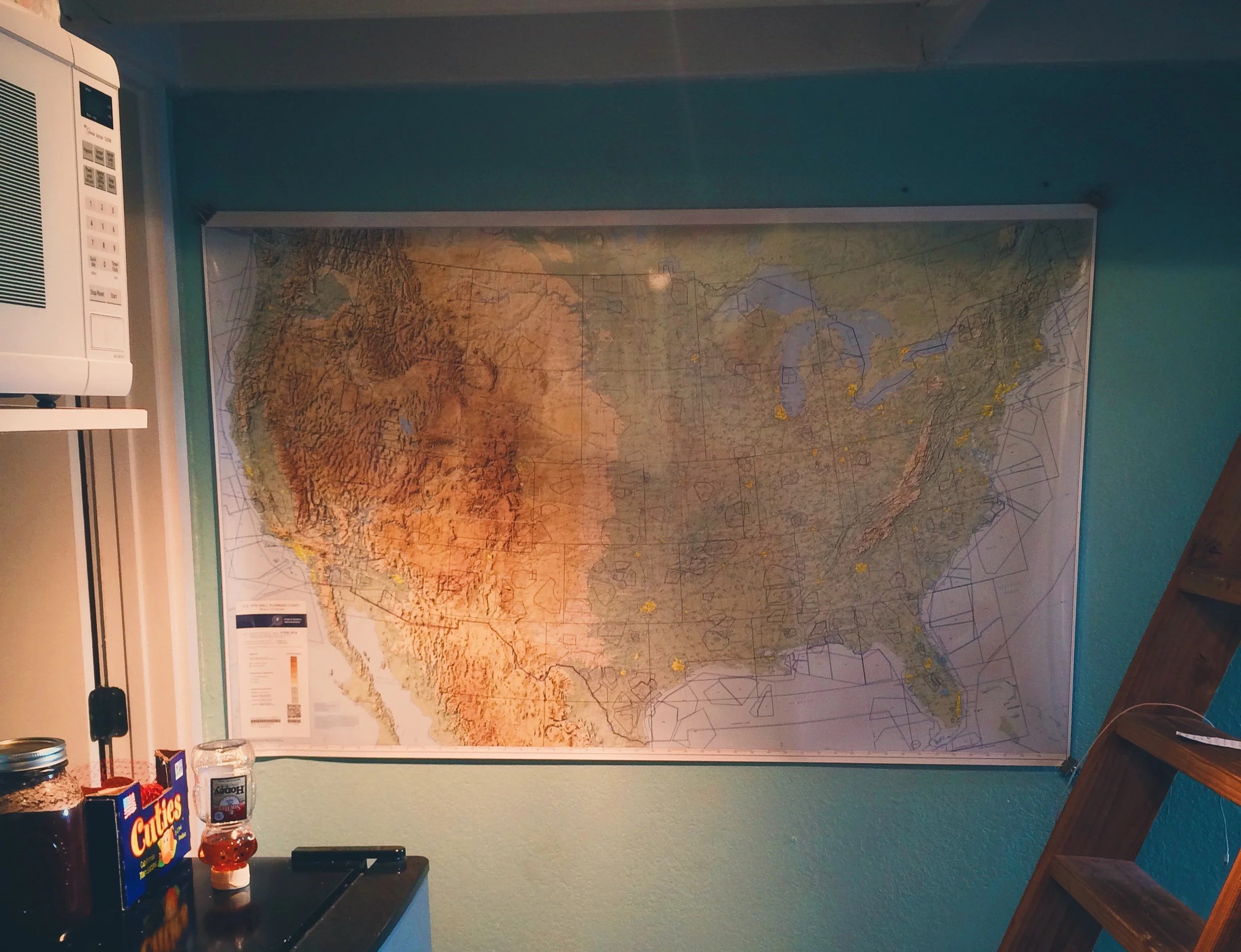 A flight planning chart hangs on my wall now. You can't see it in this shot, but there's a tiny little black dot in California. Walking by it some days, my eyes slowly scan east.